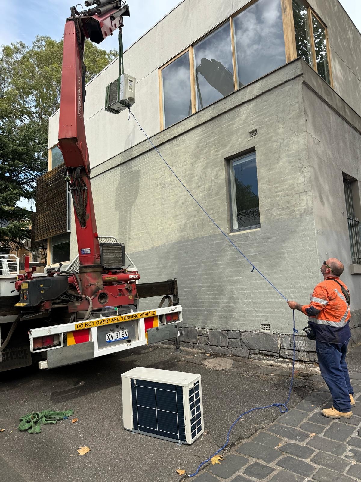 Crane mounted truck showcasing differences with a tower crane.