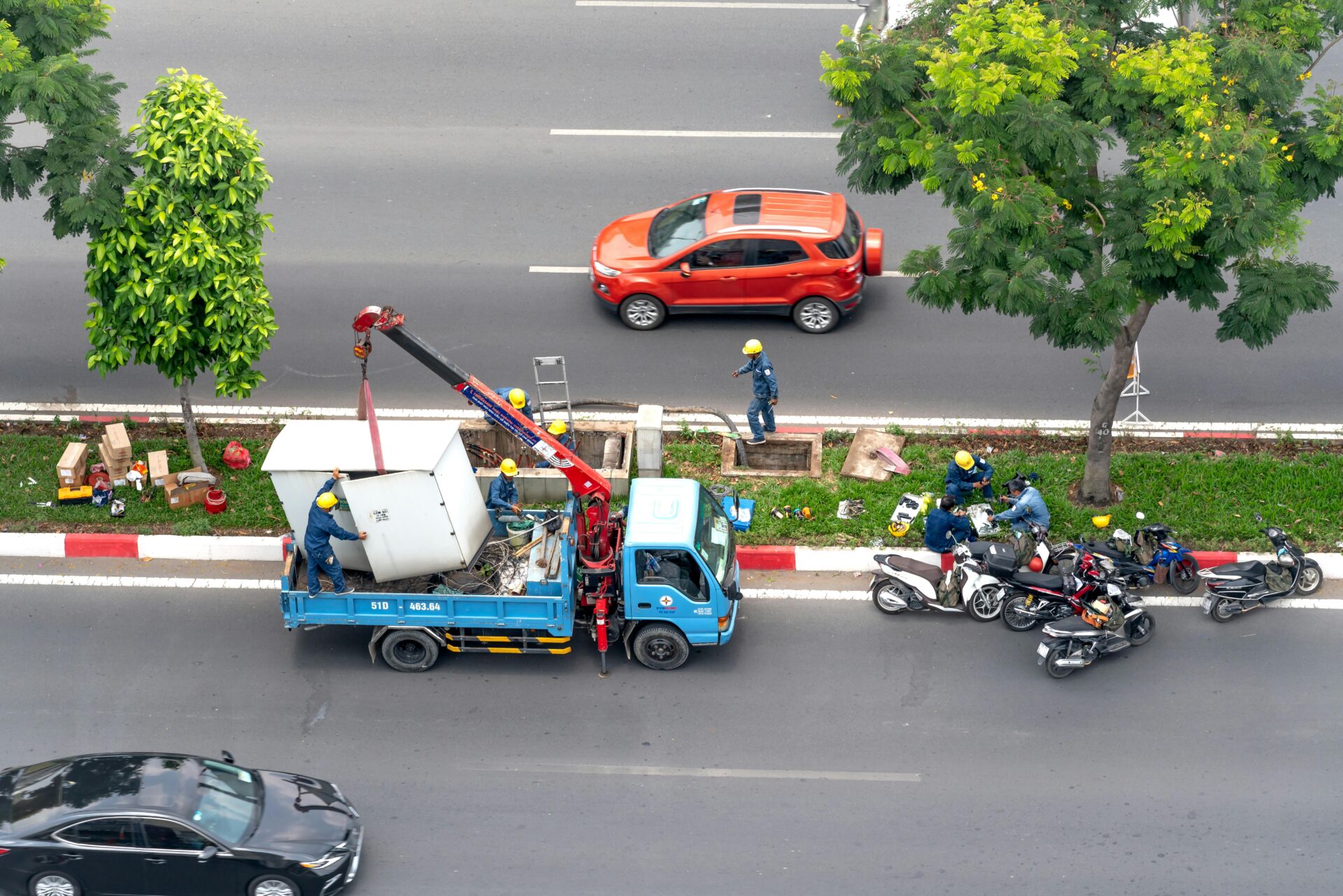 Projects rely on franna crane hire for precise precast and structural steel lifting under pressure. Credit: Photo by Quang Nguyen Vinh: https://www.pexels.com/photo/workers-hauling-transformer-onto-truck-10615322/